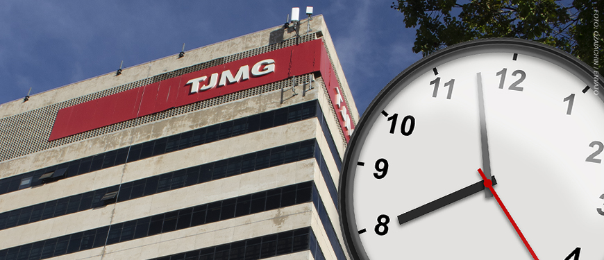 A imagem mostra a fachada do prédio do TJMG vista de baixo para cima, com um grande relógio marcando oito horas em primeiro plano simbolizando o debate sobre a jornada de trabalho. No topo lê-se “Intransigência”.