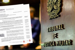 Foto do brasão do Tribunal de Justiça Militar de Minas Gerais aplicado sobre superfície de madeira ao lado direito da imagem fotos do ofício enviado ao TJMMG pelo SINJUS-MG.
