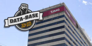 Logotipo da campanha Data-Base 2024-2025 com punho cerrado acima de faixa estilizada, sobreposto à fachada do edifício-sede do Tribunal de Justiça de Minas Gerais (TJMG), em Belo Horizonte, com céu azul ao fundo. Foto: SINJUS-MG.