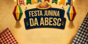 Banner de Festa Junina da ABESC, com fundo bege, bandeirinhas coloridas no topo, balões decorativos, tecidos xadrez nas laterais e o texto central “Festa Junina da ABESC” em destaque.