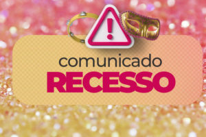 Imagem Acessível: Card informativo com fundo em tons de rosa e laranja, contendo elementos carnavalescos, como máscara, pandeiro e glitter. No topo, um ícone de alerta e o título “Comunicado – Recesso”. O texto informa que os atendimentos presenciais e online do sindicato estarão suspensos de 16 a 18 de fevereiro, devido ao Carnaval e à Quarta-feira de Cinzas, com retorno em 19 de fevereiro. Na parte inferior, está o logo do SINJUS MG assinando o comunicado.