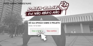 Fachada da Assembleia Legislativa de Minas Gerais em tons de cinza. Sobre a foto, há uma ilustração de um punho cerrado para o alto com o conteúdo textual escrito na cor branca: Data-Base, eu não abro mão! Abaixo há uma reprodução da caixa de enquete do site da ALMG na qual está escrito: “Dê a sua opinião sobre o projeto”, com cursor de mouse clicando sobre a opção “sou a favor”.
