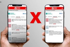 Em um fundo de cor cinza, mãos seguram celulares mostrando a divergência de informações na página da ALMG, entre os celulares encontra-se um "X" vermelho.